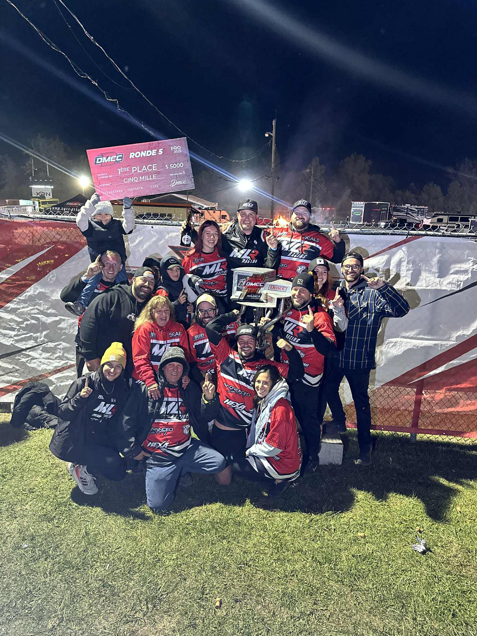 MLR Racing team celebrating a championship result